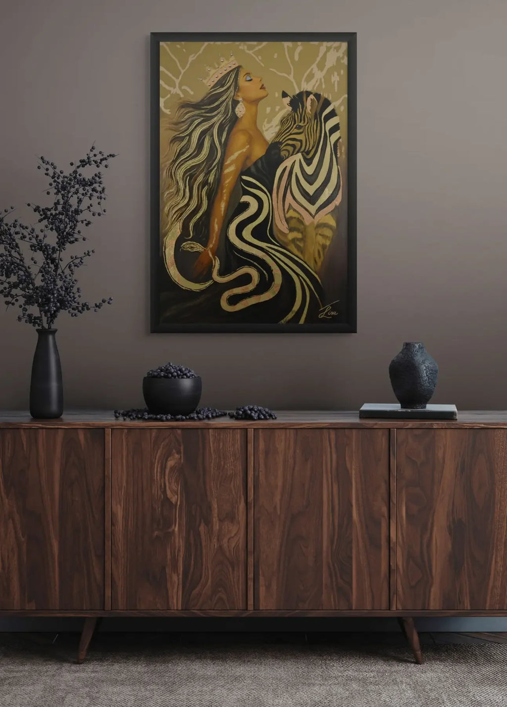 Wooden sideboard with decorative items and a Luxury original gold leaf painting with hand-applied texture and painterly detail of a woman and zebra on the wall.