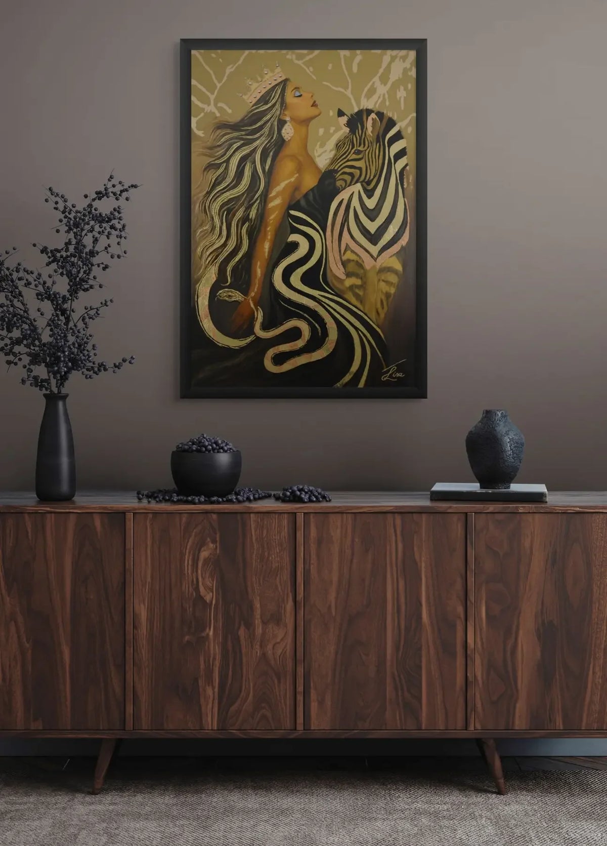 Wooden sideboard with decorative items and a Luxury original gold leaf painting with hand-applied texture and painterly detail of a woman and zebra on the wall.