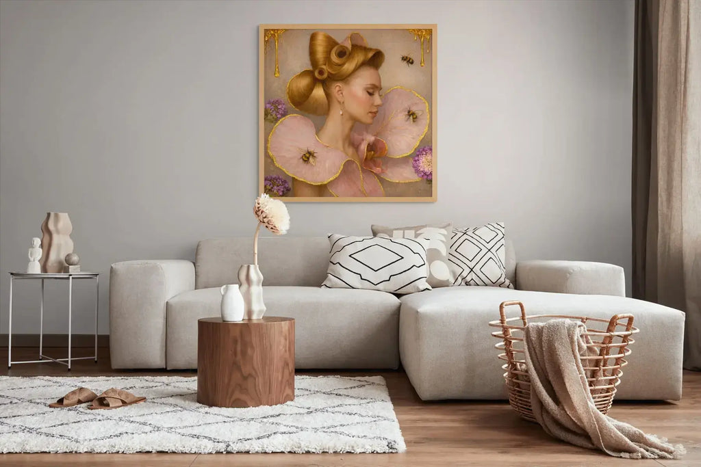 Luxury gold leaf portrait painting Gilded Honey I styled in an oak frame above a neutral grey sofa in a warm contemporary living space.