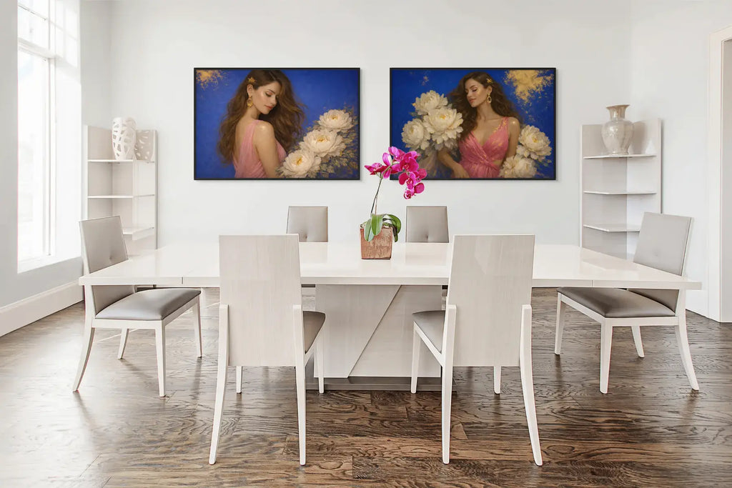 Peony Ladies diptych showcasing Ivory Reverie and Azure Opulence presented in black frames above a contemporary dining table. The gold leaf original paintings add feminine softness and refined contrast to the structured dining space, elevating the room with modern luxury.