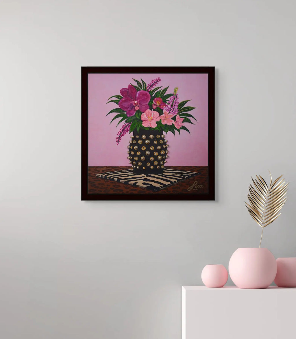 Original floral artwork styled with a pink vase accent on a console table.